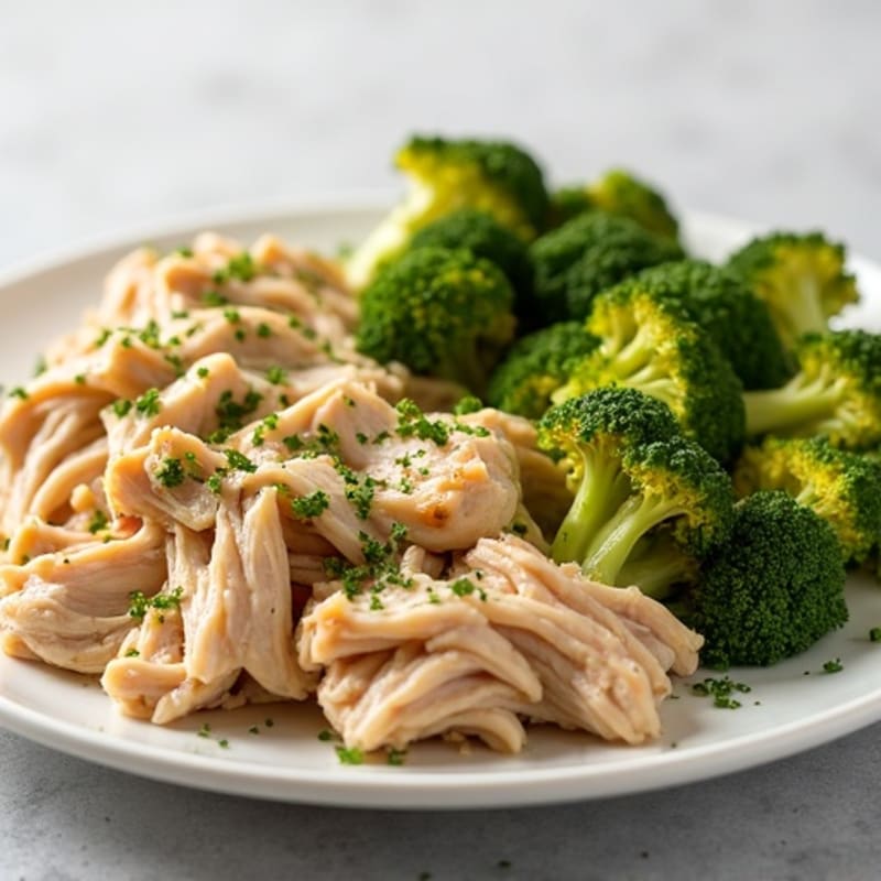 Slow Cooker Garlic Herb Shredded Chicken with Fluffy Baked Potato and Crispy Roasted Broccoli