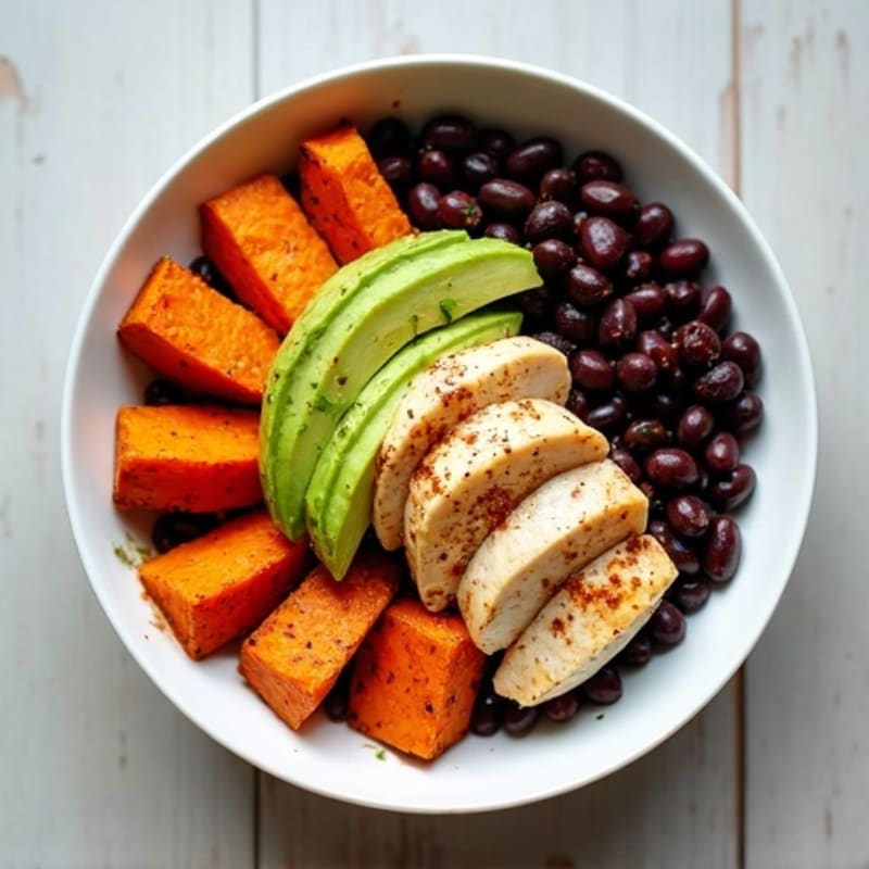 Black Bean and Roasted Sweet Potato Bowl with Creamy Avocado