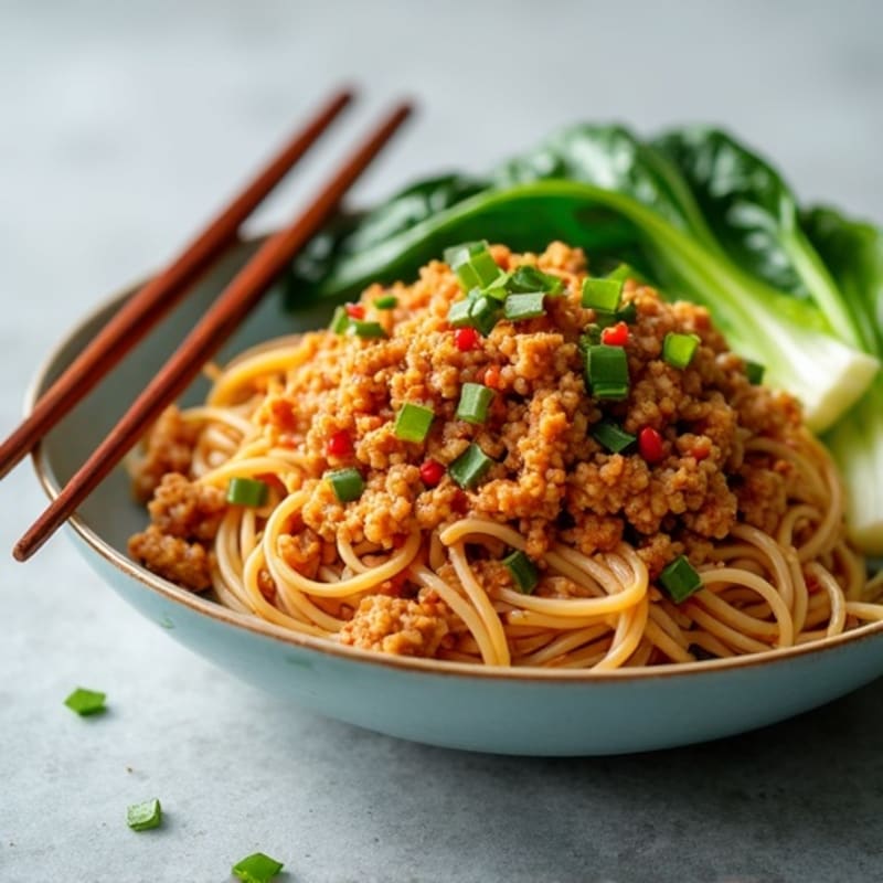 Lean Ground Pork with Spicy Peanut Noodles and Crisp Bok Choy