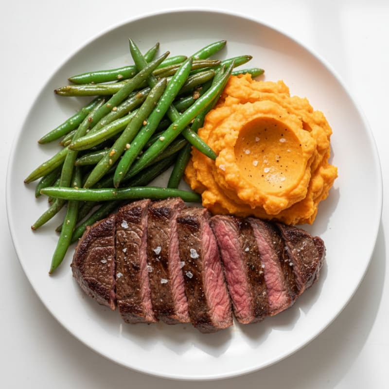 Seared Lean Steak with Garlic Green Beans and Mashed Sweet Potatoes