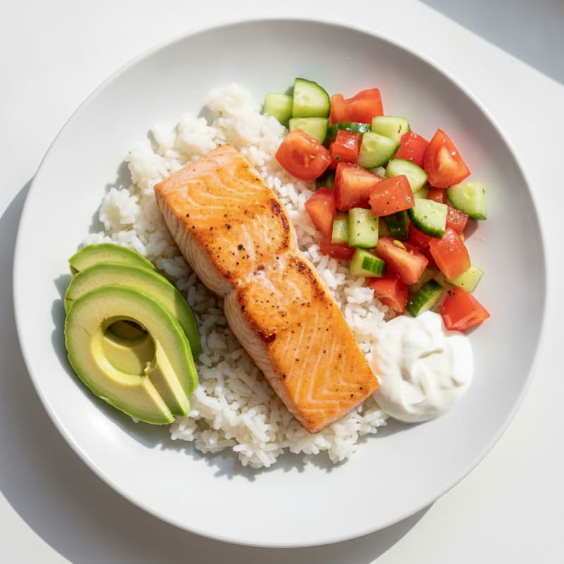 Pan-Seared Salmon with Rice, Avocado, and Tomato-Cucumber Salad
