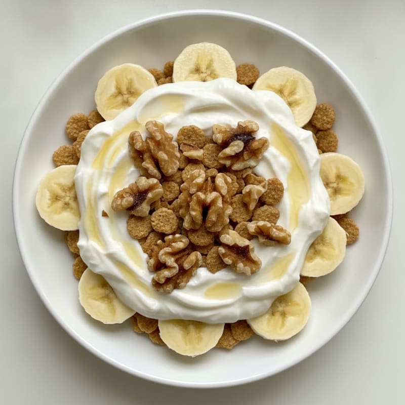 Protein Yogurt Parfait with Sliced Banana and Chopped Walnuts