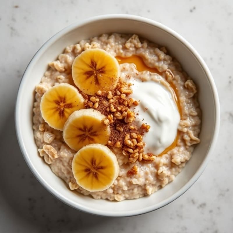 Creamy Protein Oatmeal with Spiced Caramelized Bananas and Toasted Walnuts