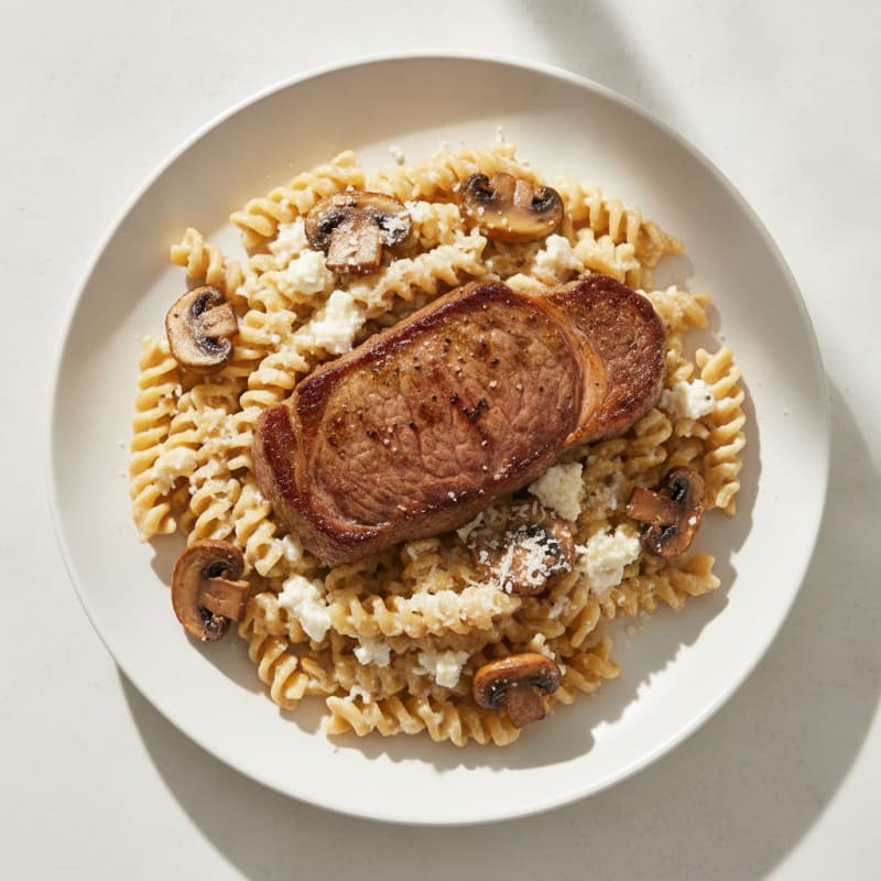 Seared Steak with Creamy Alfredo Pasta and Roasted Mushrooms