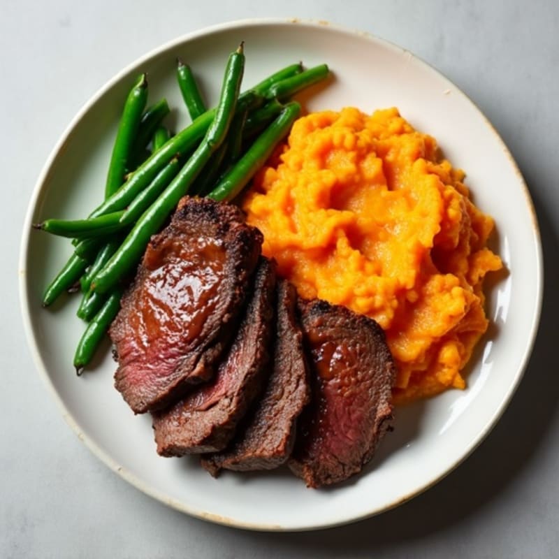 Seared Lean Beef Strips with Garlic Green Beans and Sweet Potato Mash