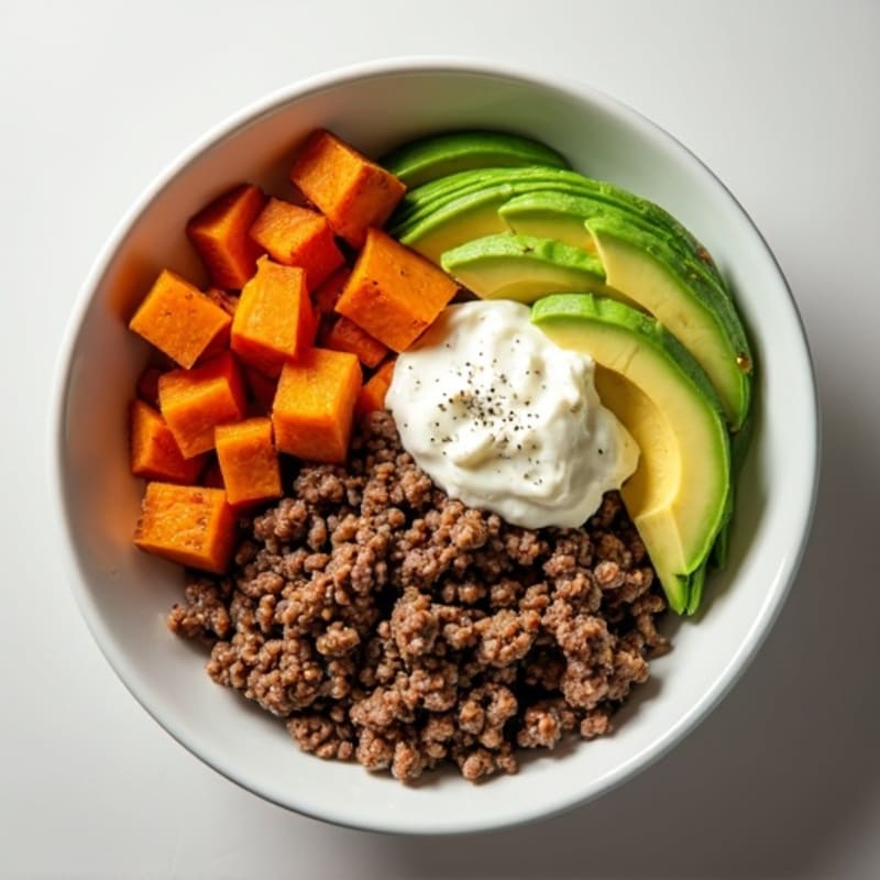Hearty Seasoned Ground Beef Bowl with Roasted Sweet Potatoes, Creamy Avocado, and Cottage Cheese