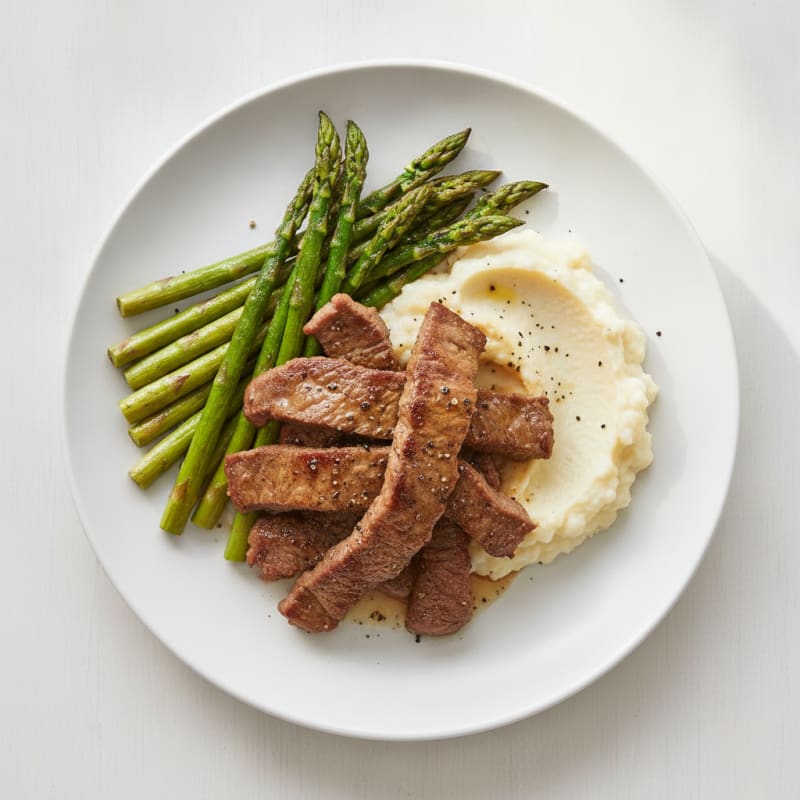 Seared Lean Beef Strips with Roasted Asparagus and Cauliflower Mash