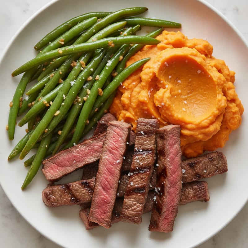 Seared Lean Beef Strips with Garlic Green Beans and Mashed Sweet Potatoes