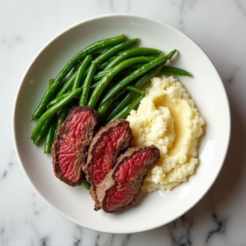 Seared Lean Beef Strips with Steamed Green Beans and Cauliflower Mash