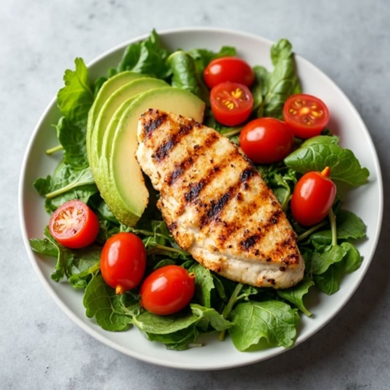Grilled Chicken Breast over Mixed Greens with Cherry Tomatoes