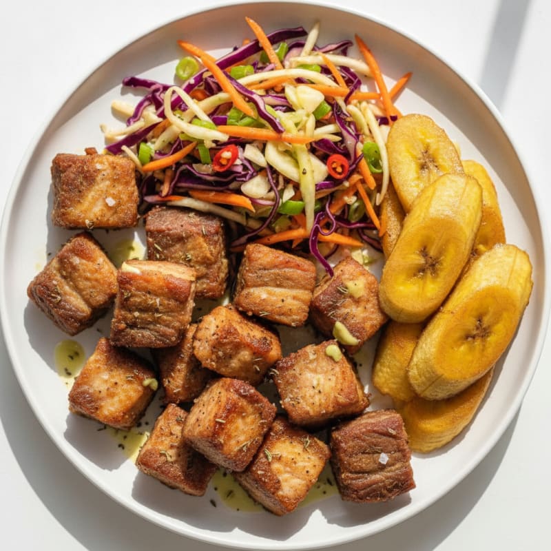 Griyo with Pikliz and Plantains