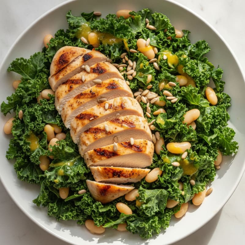 Grilled Chicken Breast over Crunchy Kale Salad with White Beans