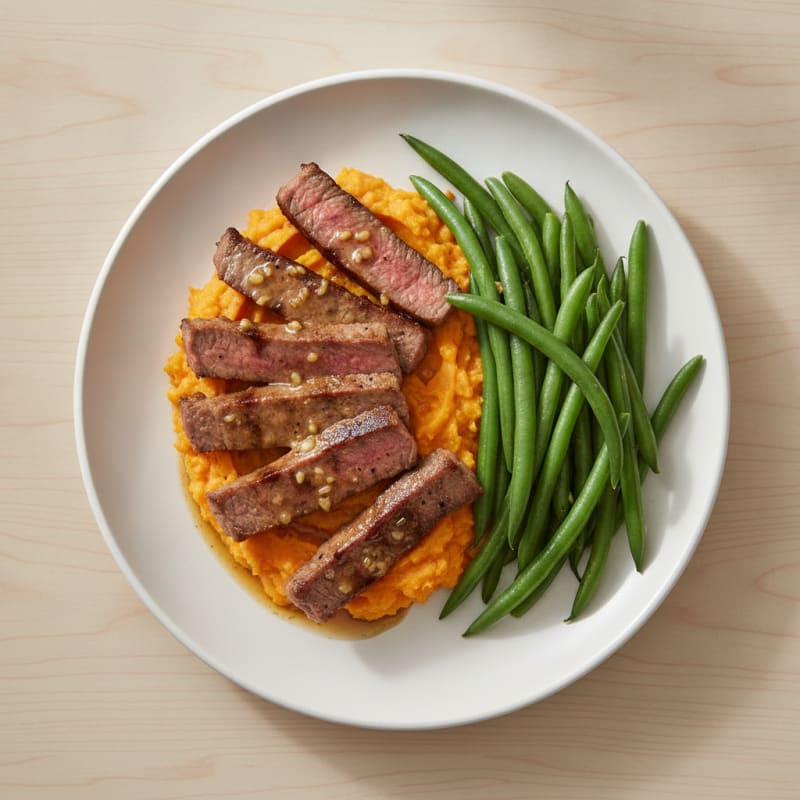 Seared Lean Beef Strips with Steamed Green Beans and Sweet Potato Mash