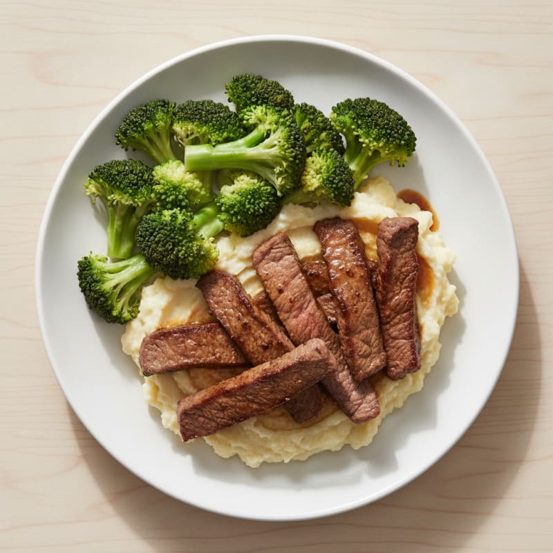 Seared Lean Beef Strips with Steamed Broccoli and Cauliflower Mash