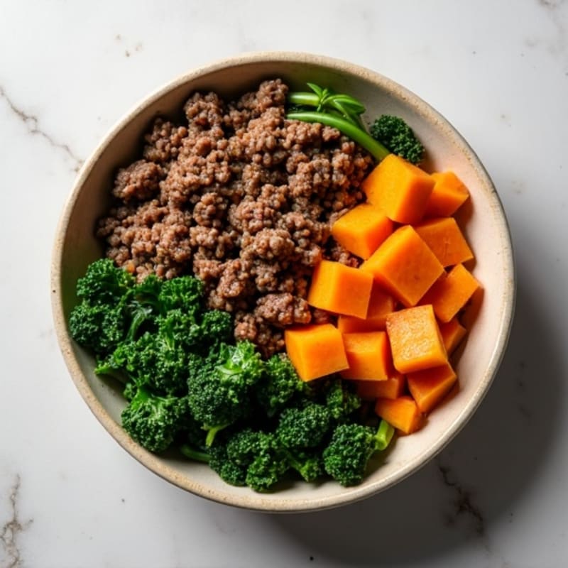 Hearty Lean Ground Beef and Roasted Sweet Potato Bowl with Sautéed Greens