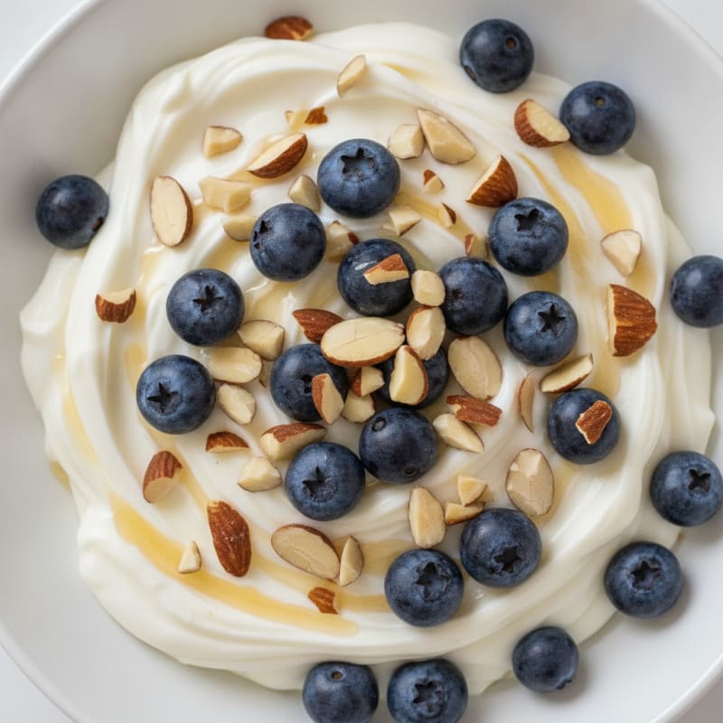 Creamy Protein Greek Yogurt with Chopped Almonds and Blueberries