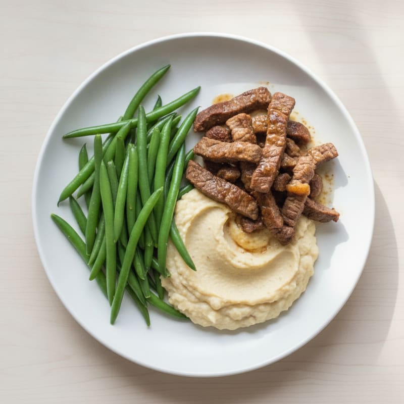 Seared Lean Beef Strips with Steamed Green Beans and Cauliflower Mash