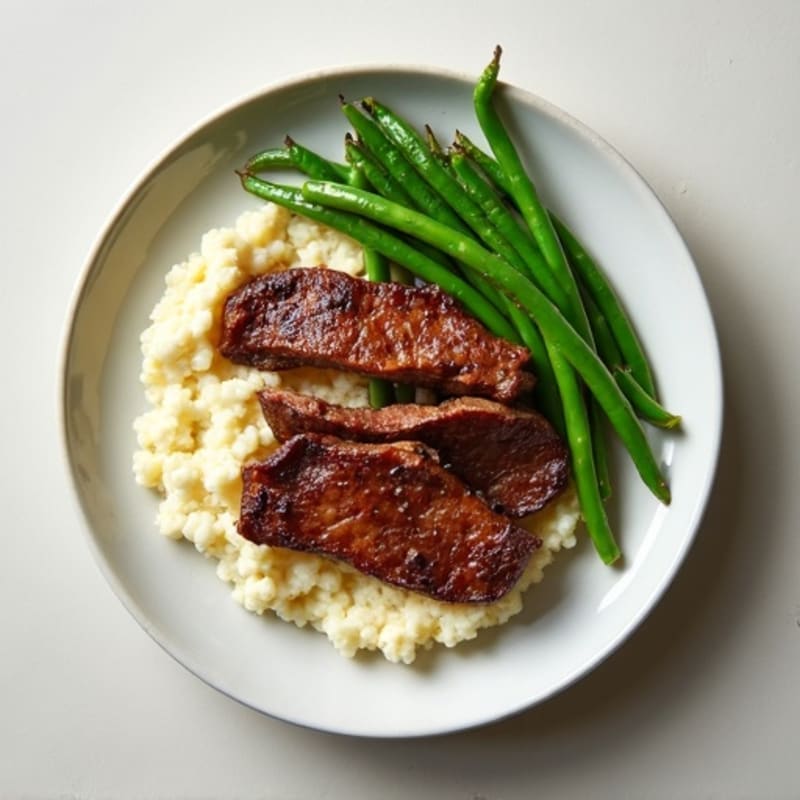 Seared Lean Beef Strips with Steamed Green Beans and Cauliflower Mash