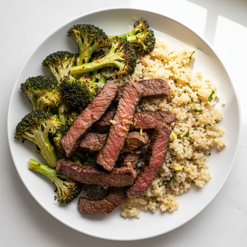 Seared Lean Beef Strips with Roasted Broccoli and Garlic Quinoa