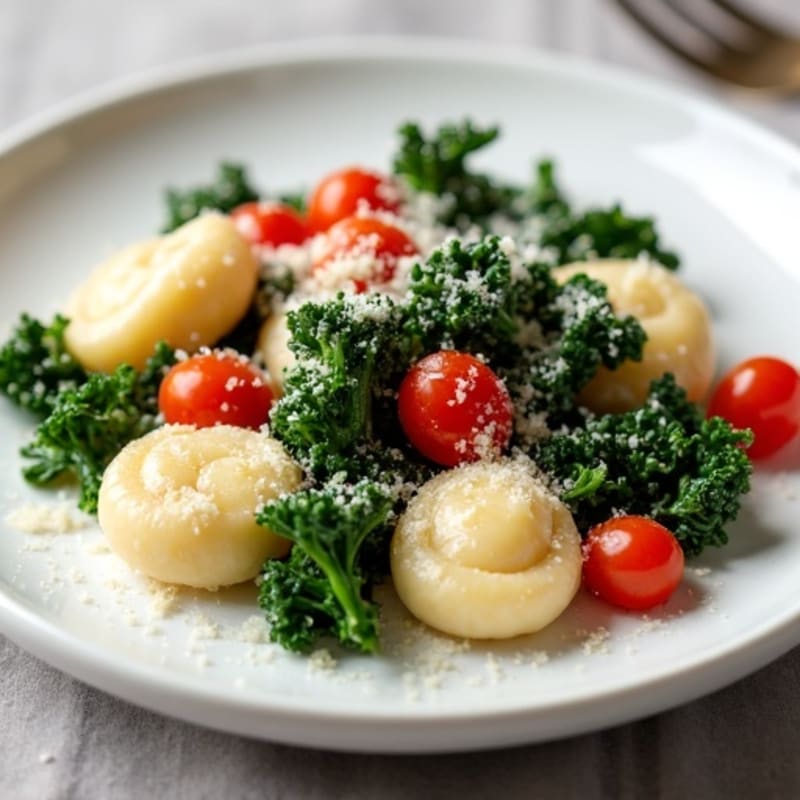Silky Ricotta Gnocchi with Sautéed Greens and Fresh Cherry Tomatoes