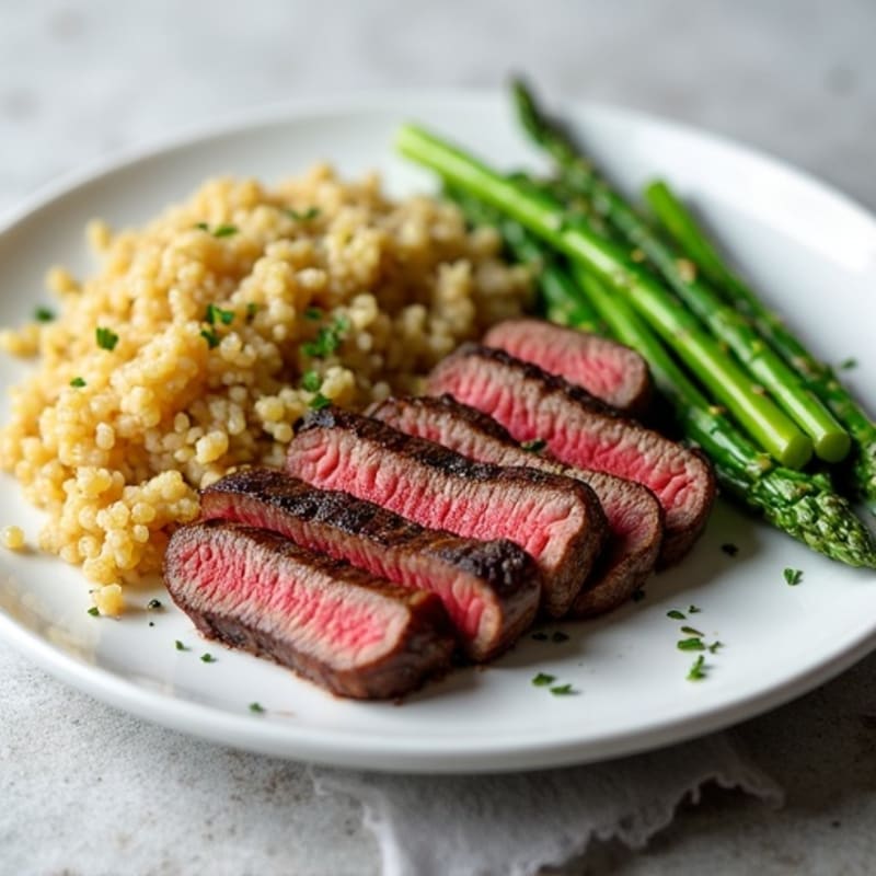Seared Lean Beef Strips with Steamed Asparagus and Quinoa