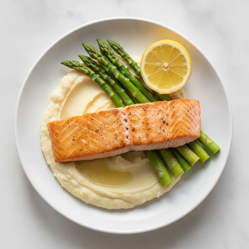 Seared Salmon Fillet with Creamy Garlic Cauliflower Mash and Steamed Asparagus