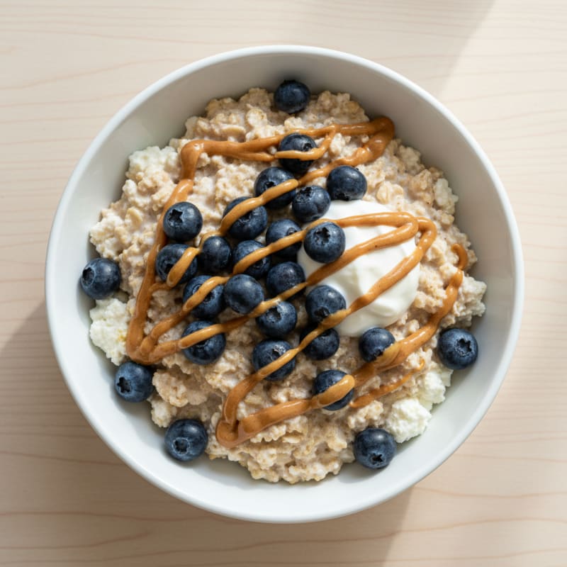 Protein Oats with Cottage Cheese, Blueberries, and Peanut Butter