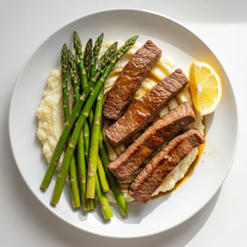 Seared Lean Beef Strips with Roasted Asparagus and Cauliflower Mash