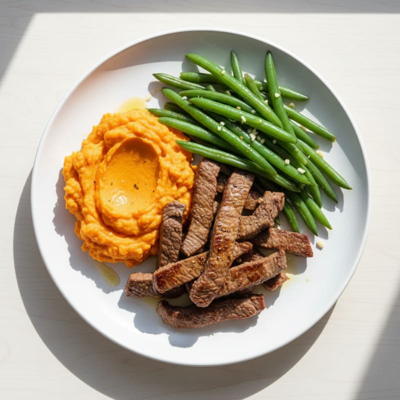 Seared Lean Beef Strips with Steamed Green Beans and Sweet Potato Mash