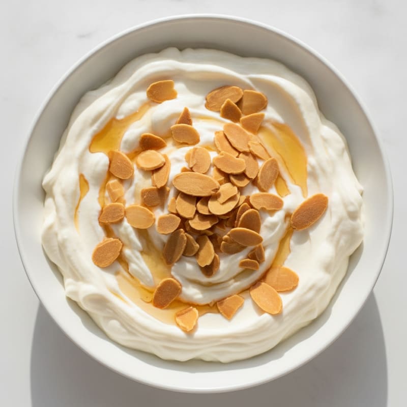 Vanilla Greek Yogurt Protein Pudding with Almonds