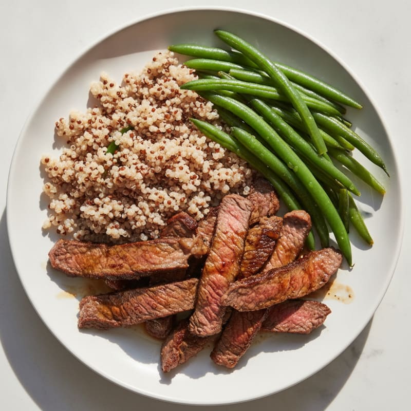Seared Lean Beef Strips with Steamed Green Beans and Quinoa