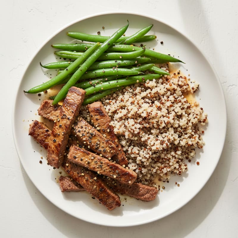 Seared Lean Beef Strips with Steamed Green Beans and Quinoa