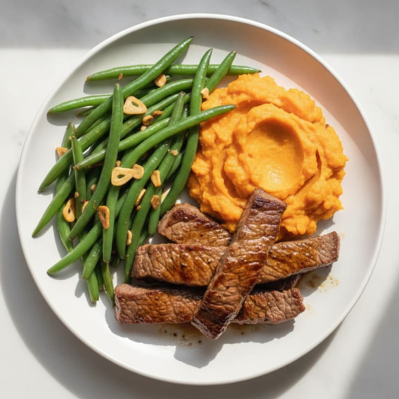 Seared Lean Beef Strips with Garlic Green Beans and Sweet Potato Mash