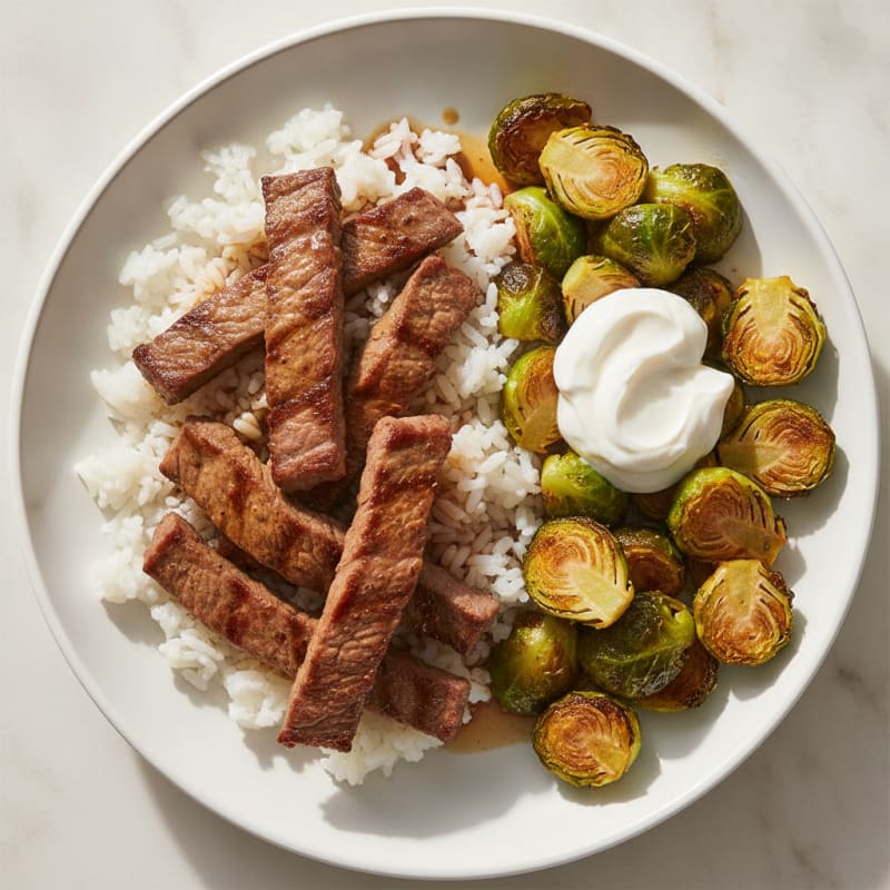 Seared Beef Strips with Roasted Brussel Sprouts and Rice