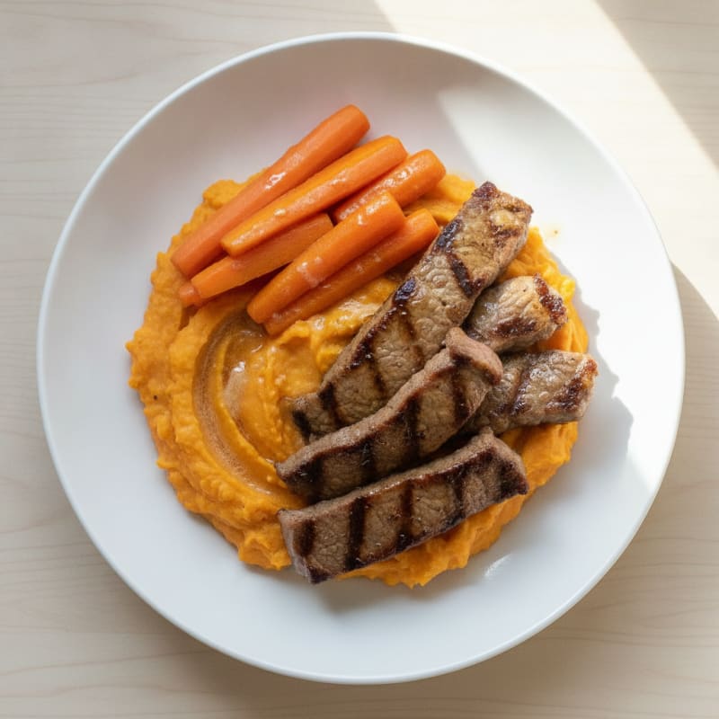 Seared Beef Strips with Sweet Potato Mash and Steamed Carrots