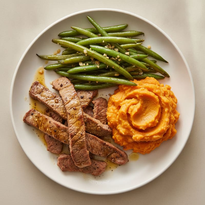 Seared Lean Beef Strips with Garlic Green Beans and Mashed Sweet Potatoes