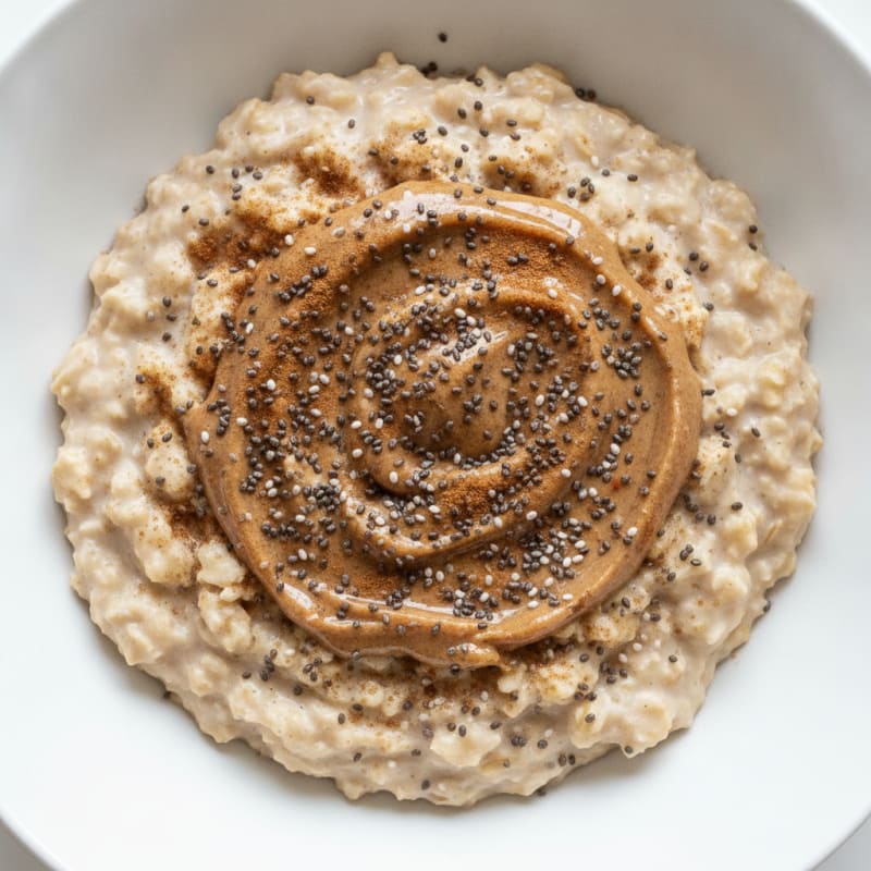 Creamy Vanilla Protein Oats with Almond Butter and Chia Seeds