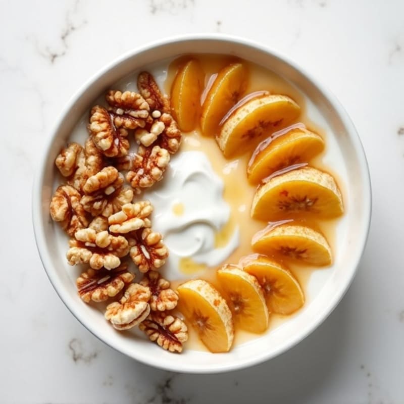 Creamy Protein Yogurt Bowl with Warm Caramelized Bananas and Crunchy Walnuts