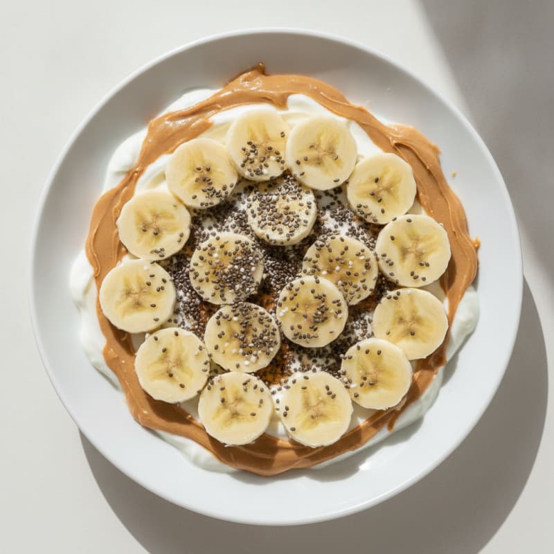 Creamy Greek Yogurt with Peanut Butter, Chia Seeds and Sliced Banana