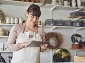 Image of small business owner working on tablet