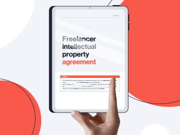Tablet being held with IP agreement template on it.