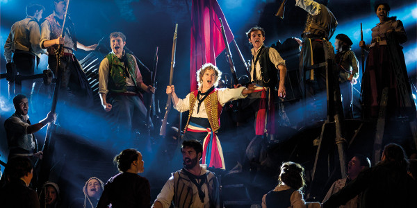 Ashley Gilmour as Enjolras, Harry Apps as Marius and Company in Les Mis. Photo by Michael Le Poer Trench.