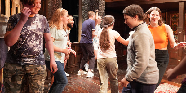 Children enjoying the Kids Week stage combat workshop at The Play That Goes Wrong