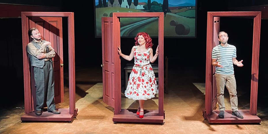 Three of the cast standing in three doorframes.