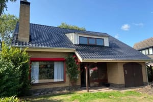 Woning voorzien van dakpannen