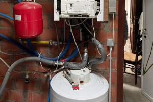 Oude ketel en boiler verwijderd  nieuwe ketel geplaatst  Cv En San  ruimtebesparend