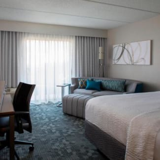 King guest room area with desk