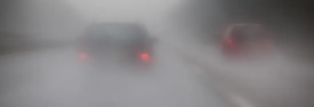 Cars Om Motorway With Rain And Fog