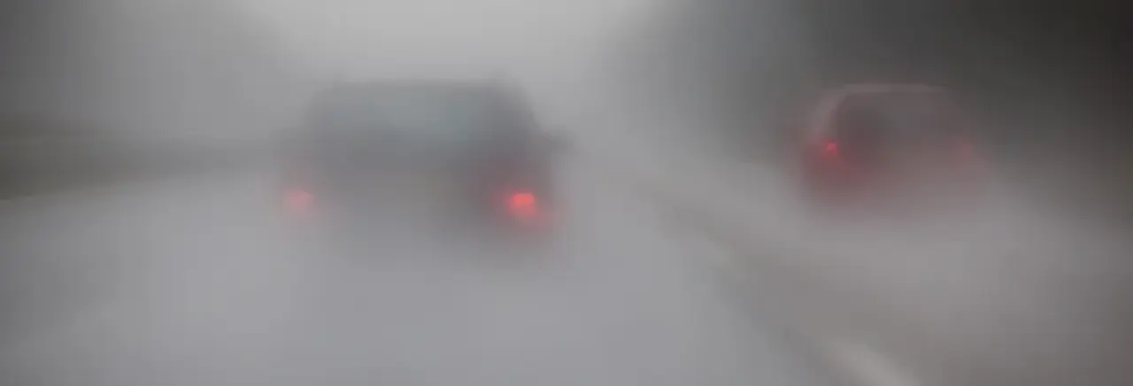 Cars Om Motorway With Rain And Fog