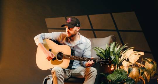 Guitarist and Vocalist - Ali Moore